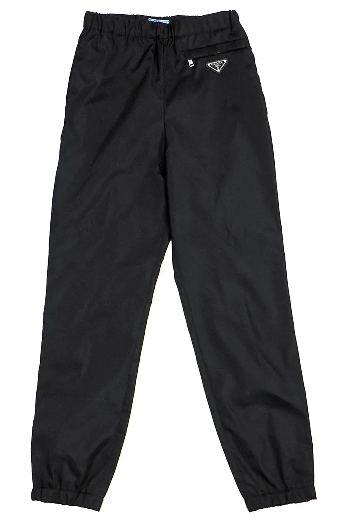 Hose Prada in black Re-Nylon in recycled gabardine and elastic belt, pre-owned item, front view