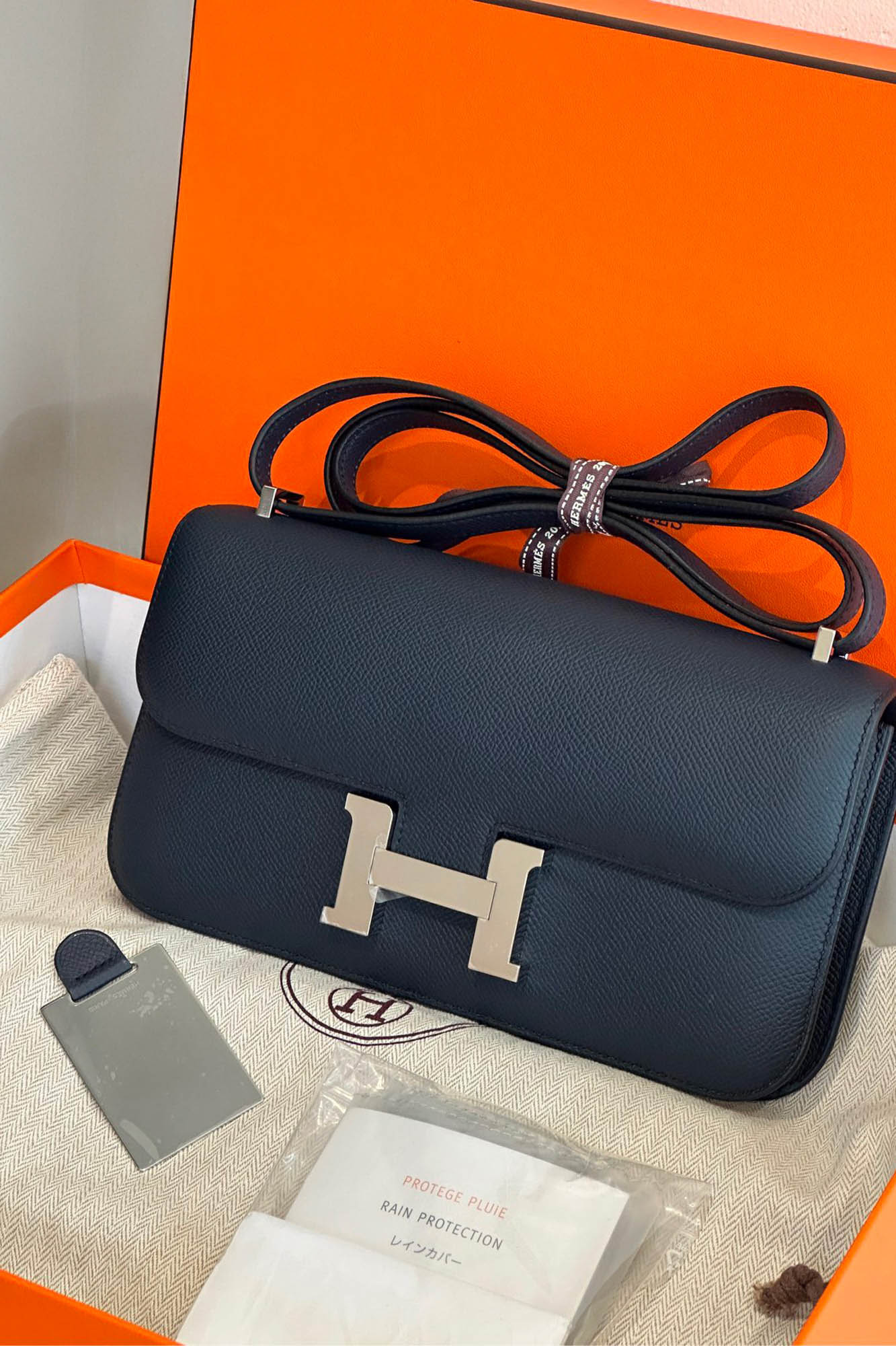 Hermès Constance Élan preloved bag in Prussian Blue Epsom leather with original Hermès box and accessories.