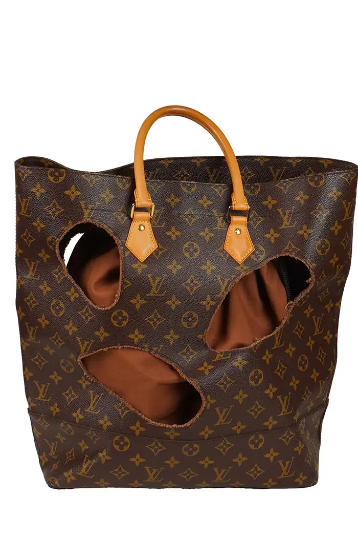 Louis Vuitton x Comme des Garçons "With Holes" preloved bag in Monogram canvas, front view.