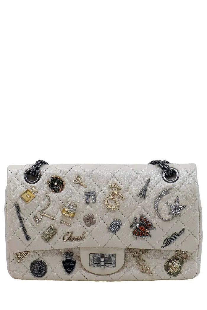 Front view of Chanel 2.55 preloved bag in iridescent leather with antiqued silver chain.