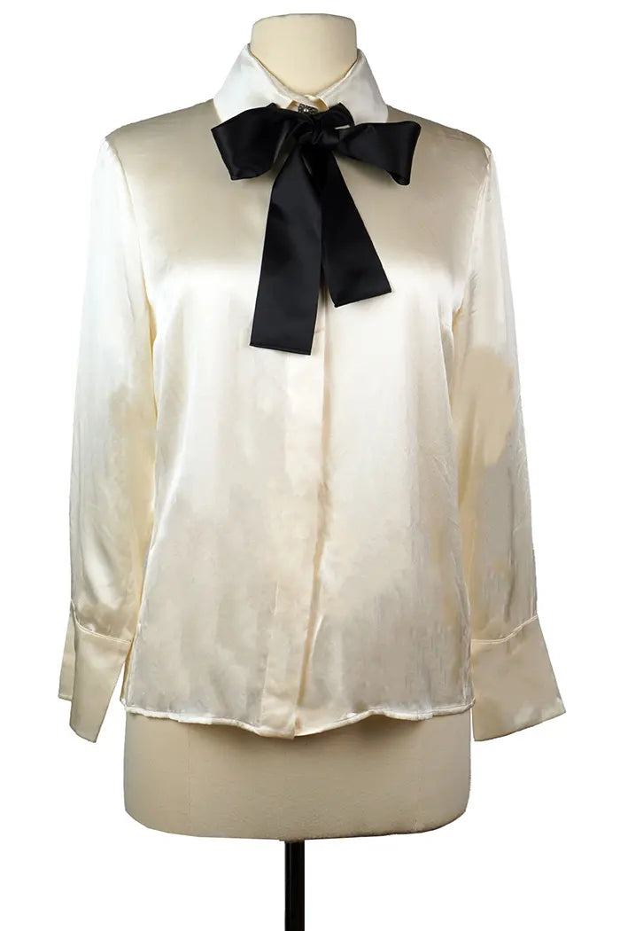 Chanel preloved shirt in cream silk with detachable black tie, front view.