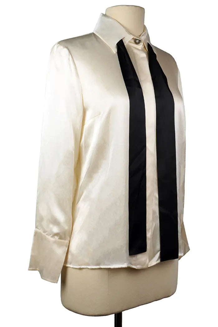 Side view of Chanel preloved shirt, collar with detached black tie.