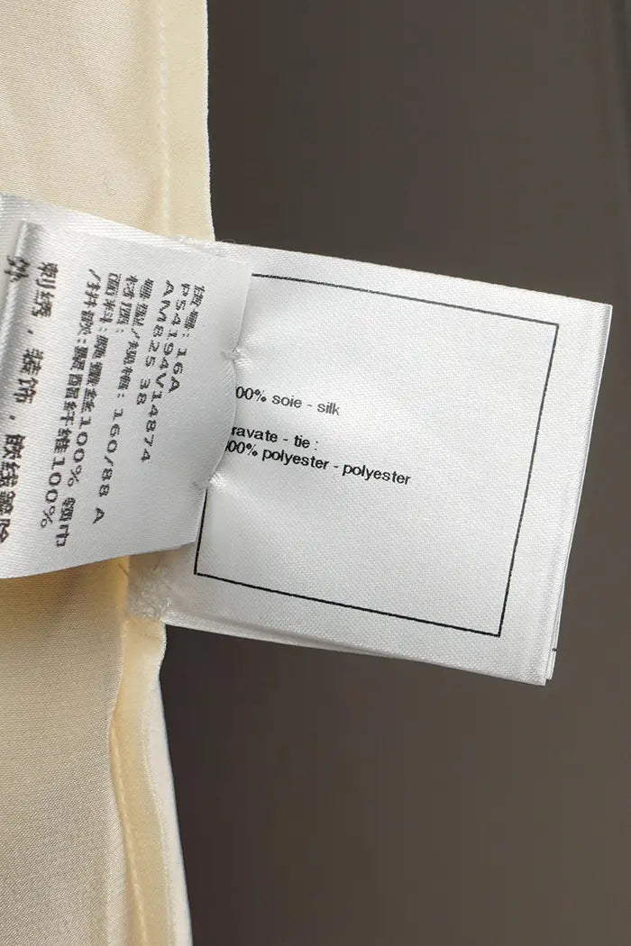 Detail on the composition label of the Chanel 100% silk blouse