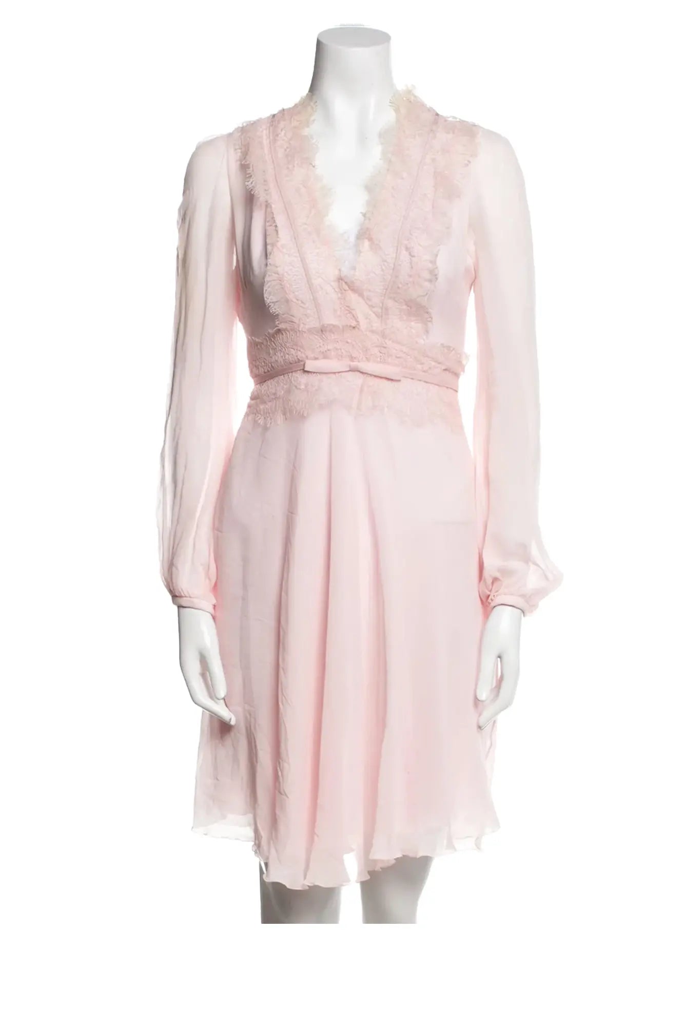 Giambattista Valli pink silk mini-dress on mannequin, A-line cut, long sleeves, V-neckline and lace details with decorative bows.
