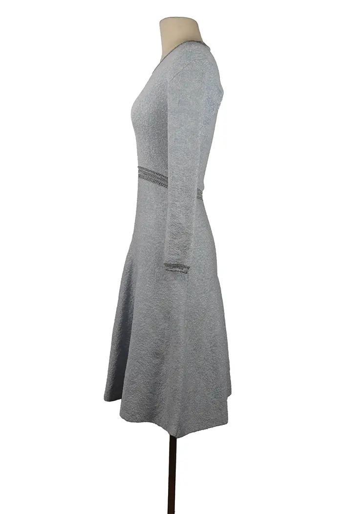 Left profile of Dior dress in blue-gray, structured, flowing silhouette, ideal for a cocktail party, dinner party or elegant evening wear.