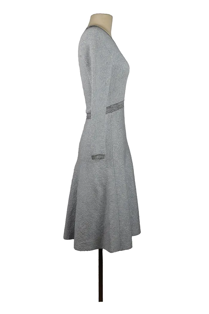 Right-side view of Dior mini-dress on mannequin, lightweight viscose fabric, short cut and clean lines for a dressy look.