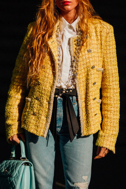 A model wearing yellow tweed jacket with white shirt and blue jeans. Jacket reference 1000004. Reench preloved.