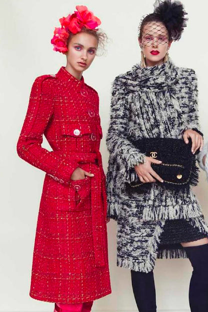 Shot of two models, one is wearing red coat Chanel and the other a gray coat. Chanel. ref. 1000006. 