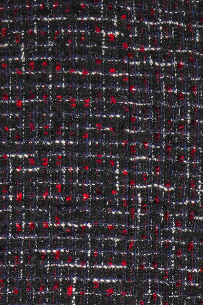 Close-up of amazing tweed Chanel. Black tweed with white and red thread. Ref. 1000011, preloved Chanel, Reench.