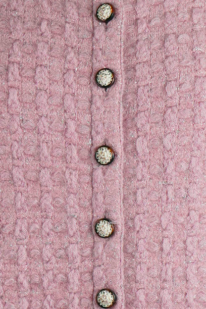 Close-up of the Chanel pink cardigan's buttons with lion head. Ref. 1000018. Reench preloved.