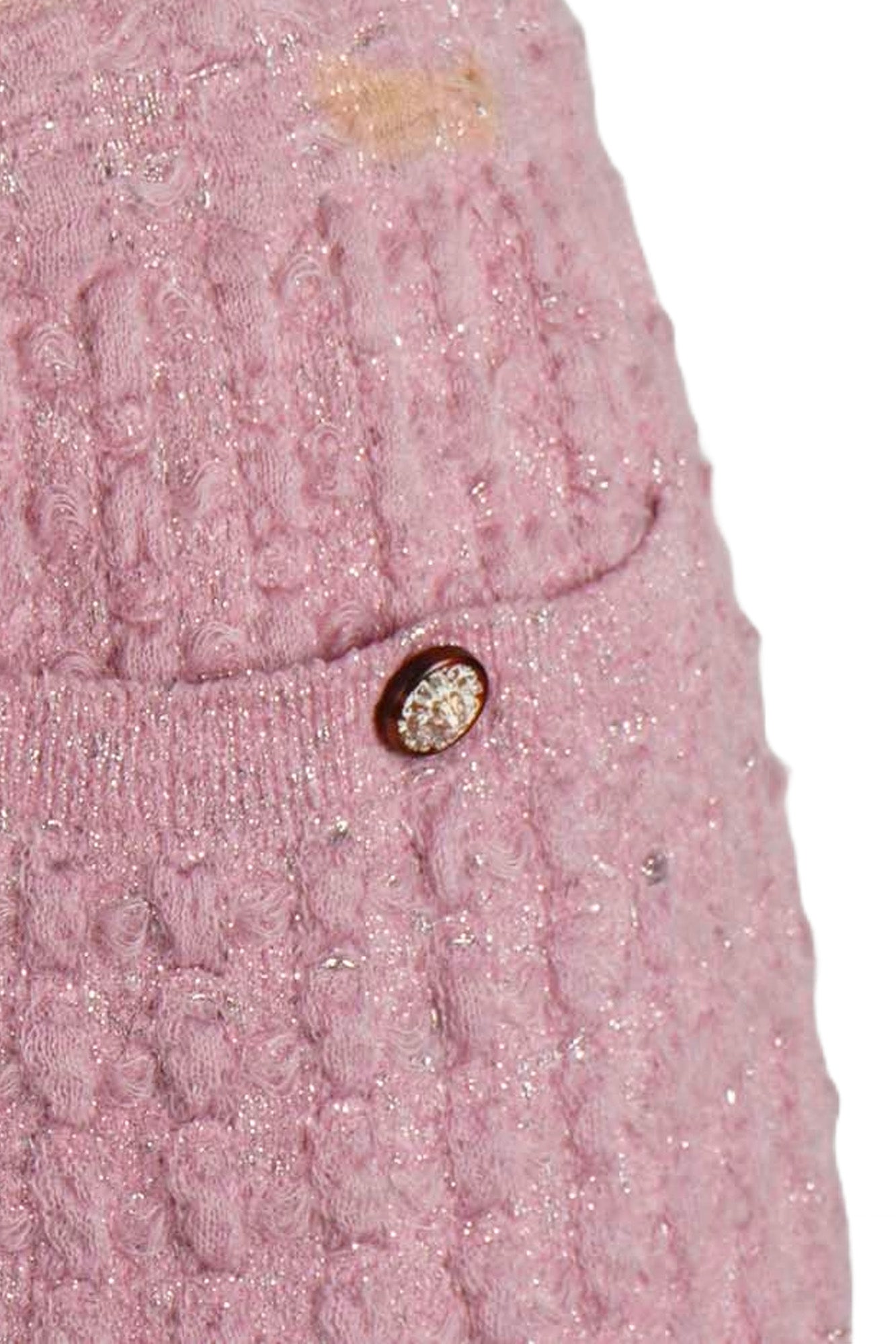 Chanel knit skirt by Karl Lagerfeld, casual fall-winter look, flared silhouette, certified authentic, sustainable fashion. One-day delivery via DHL. | Close-up of the pocket, button, and stain