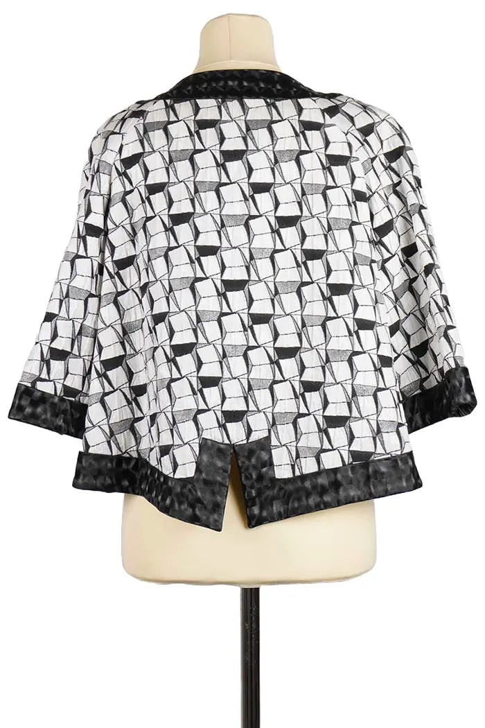 Chaqueta Chanel de algodón blanco y negro, artículo de segunda mano, vista trasera
