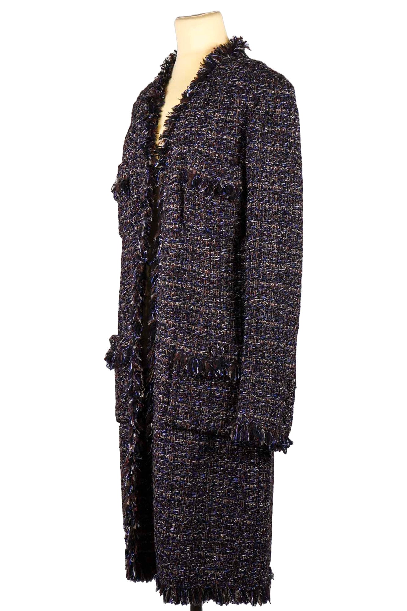 Three-quarter view of Long Tweed coat with fringes, reference 1000062. Chanel preloved, Reench.