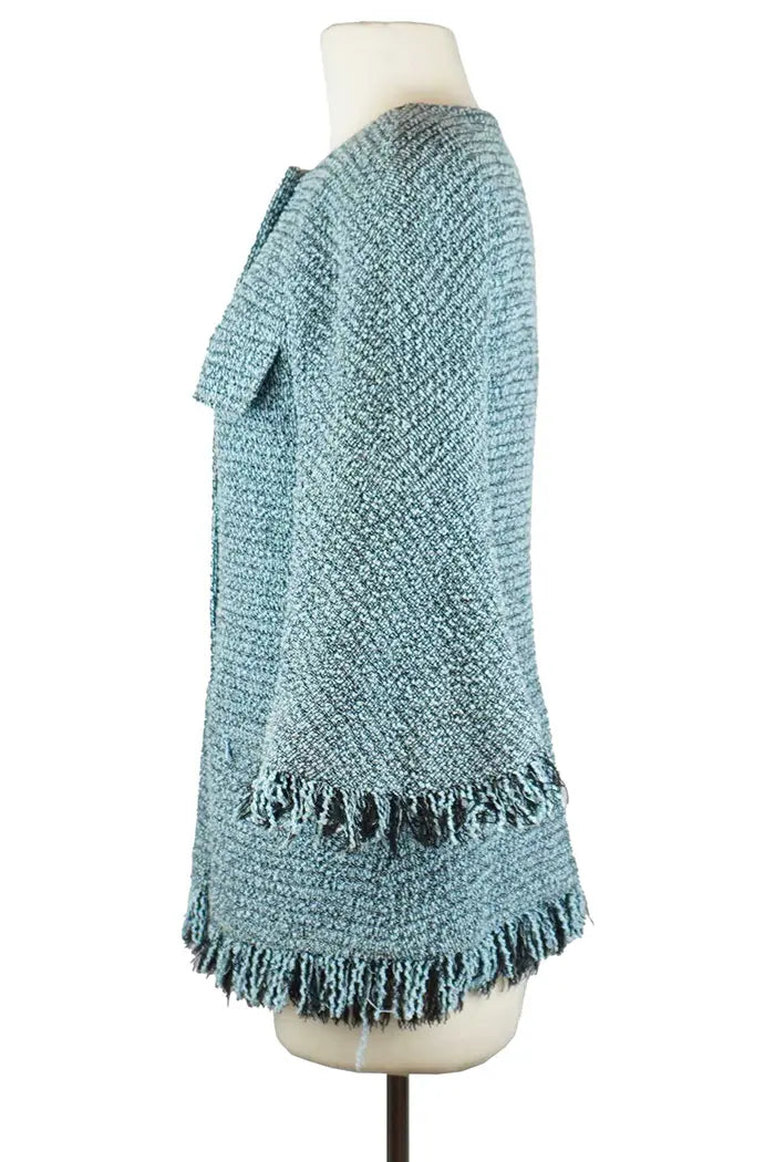 Chaqueta de tweed azul, artículo usado, vista de perfil izquierdo