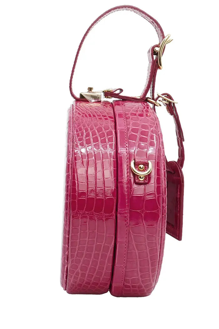 Sac Louis Vuitton 'Petite Boite Chapeau'  rose en cuir d'alligator, article d'occasion, vue de côté