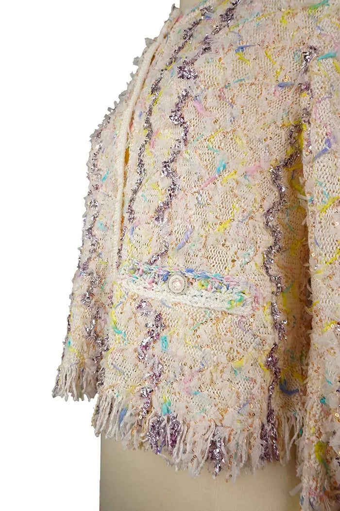 Chanel tweed pastel Cardigan , spring/summer 2022 collection, pre-owned item, zoom on cardigan finishings in 3/4 view