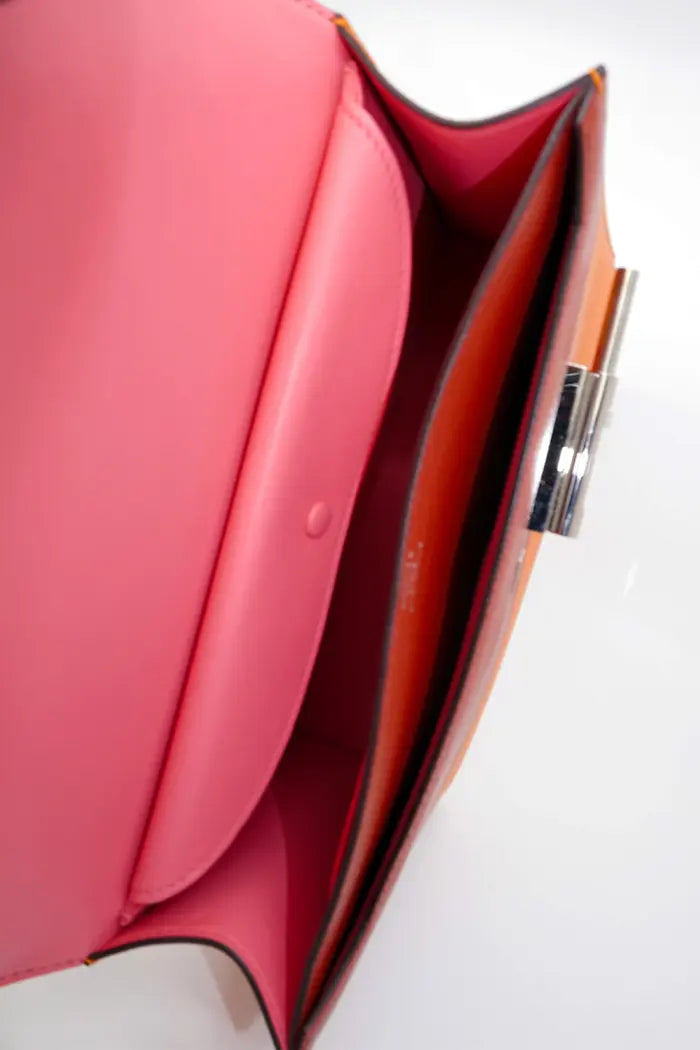 Hermes Verrou bag in orange Epsom leather, pre-owned item, view of open bag showing pink interior
