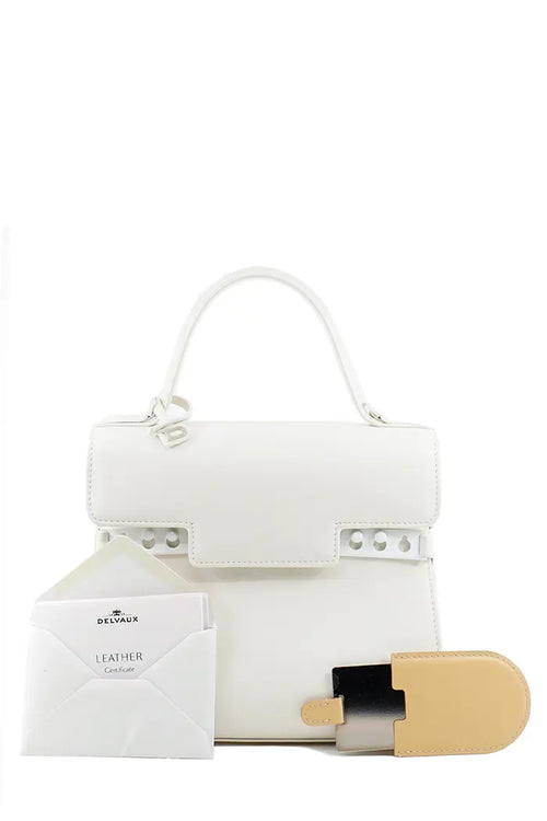 Bolso Delvaux Tempête en piel de becerro crujiente color marfil, artículo usado, vista frontal con espejo y certificado