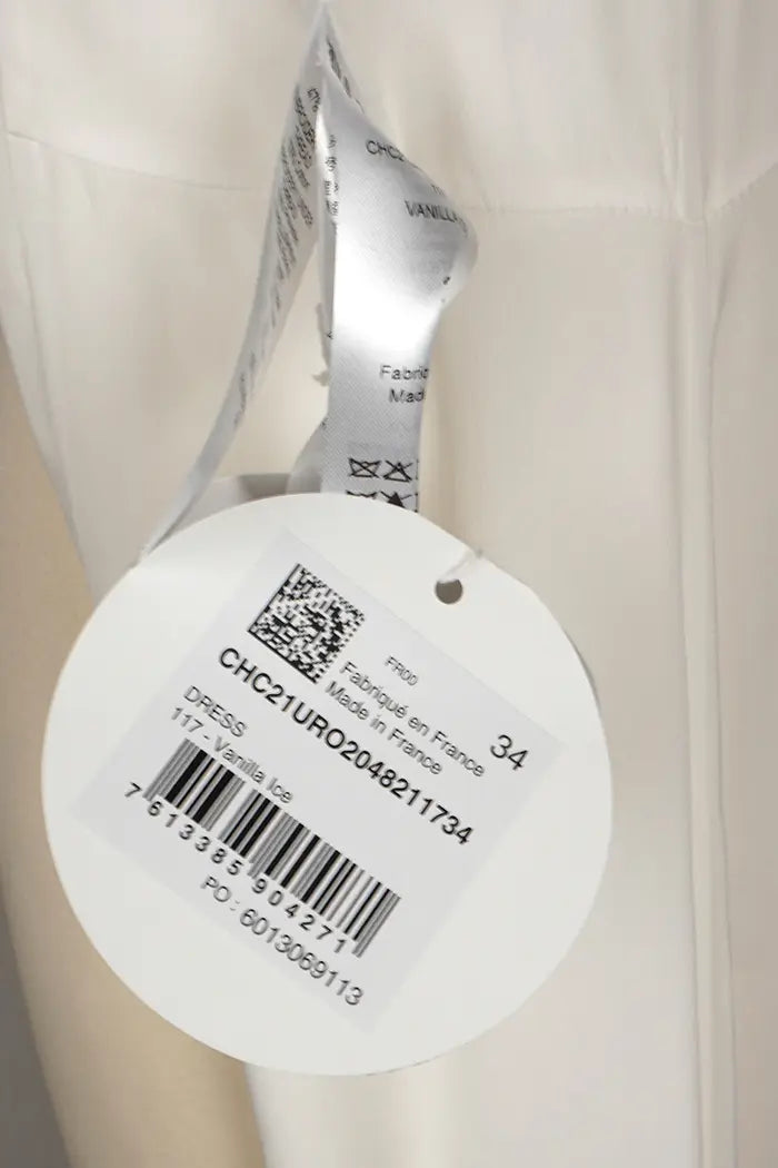 Vestido blanca Chloé de largo medio, artículo de segunda mano, zoom en la etiqueta, nunca usada
