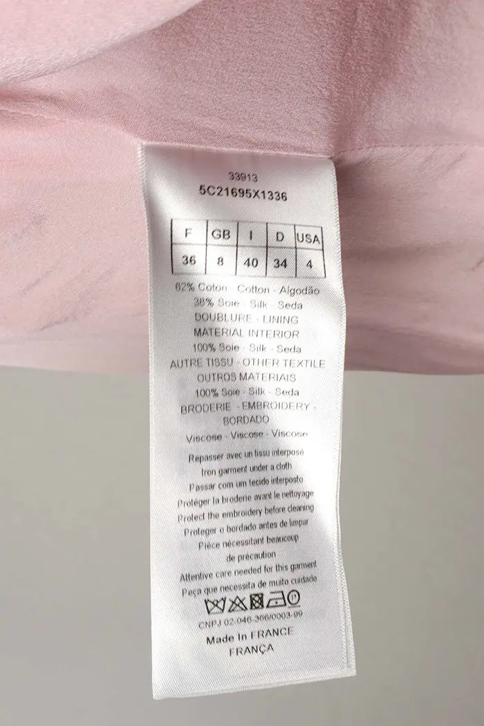 Christian Dior Kleid in Puderrosa und mit 3/4-Ärmeln, gebrauchter Artikel, Zoom auf das Zusammensetzungsetikett