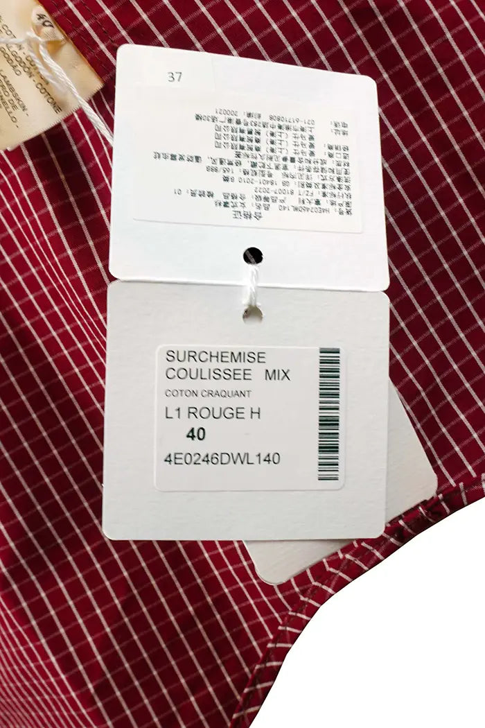 Sur-chemise Hermès 100 % coton, à carreaux rouges, article d'occasion, zoom l'étiquette de vente d'origine