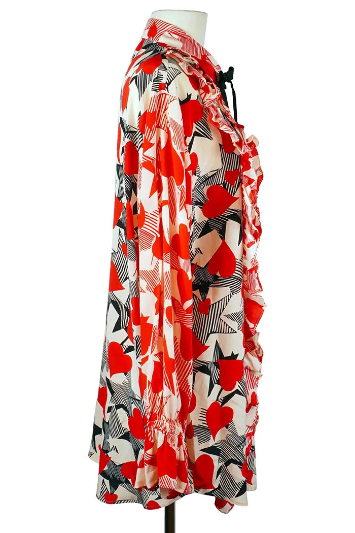 Blusa suelta Gucci en seda con corazones rojos y negros entrelazados, prenda de segunda mano, vista lateral