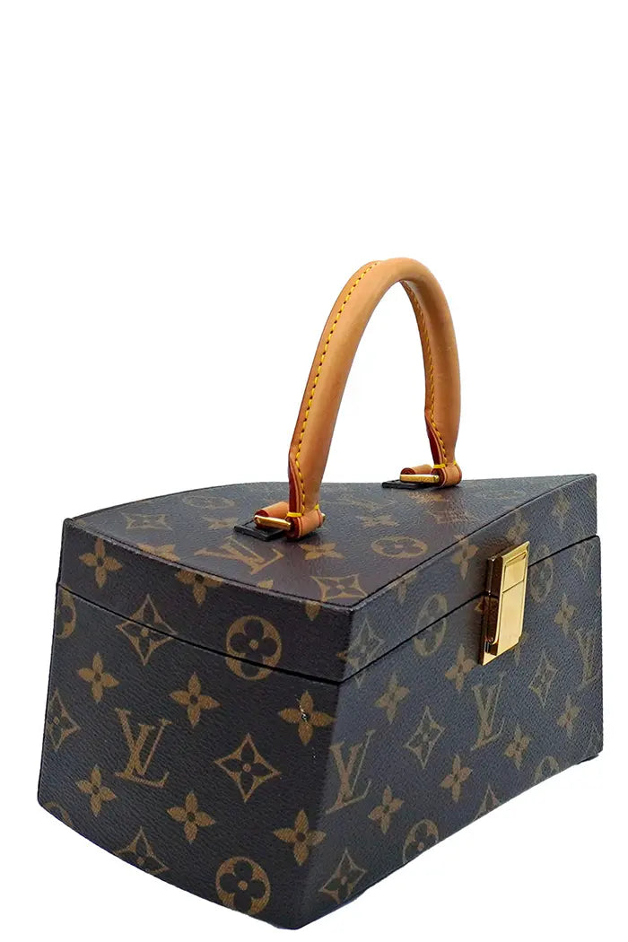 Profile of the Louis Vuitton Twisted Box bag, original asymmetrical shape, very rare preloved bag.