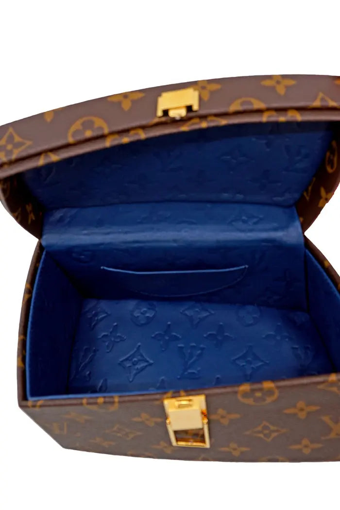View of the blue interior compartment of the Twisted Box bag