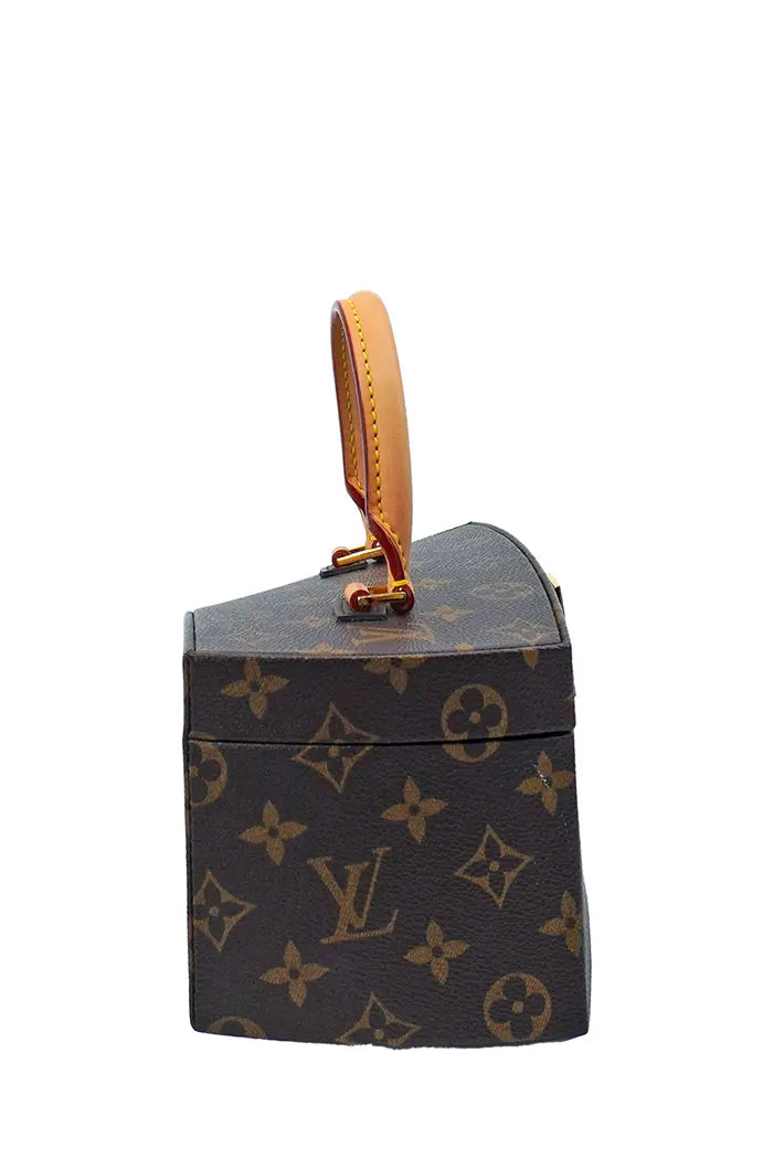 Profile of the Louis Vuitton Twisted Box bag, original asymmetrical shape.