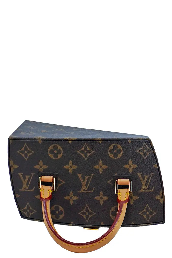 Top view of the Louis Vuitton x Gehry bag, detail of the handle in very good condition and the monogram canvas.