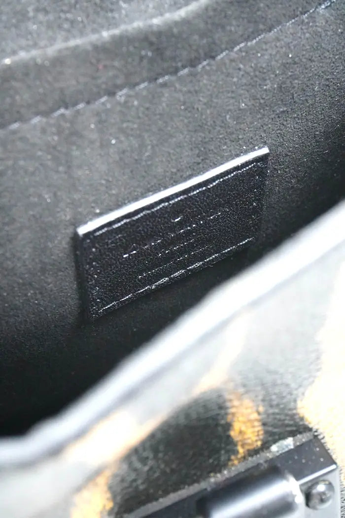Close-up of the Louis Vuitton label inside the bag