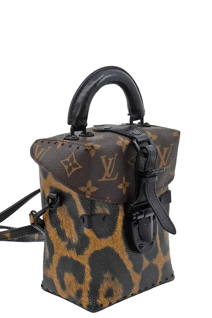Profile of Louis Vuitton Camera Box preloved bag showing depth and rigid structure.