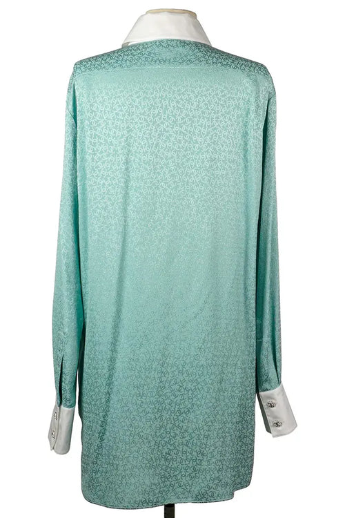 Vue arrière de la tunique Chanel en soie turquoise preloved, coupe droite.