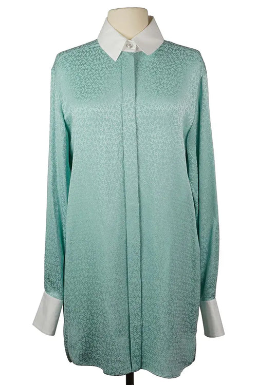 Tunique Chanel en soie turquoise avec col  et manches blancs et boutons brillants à motif CC, vue de face
