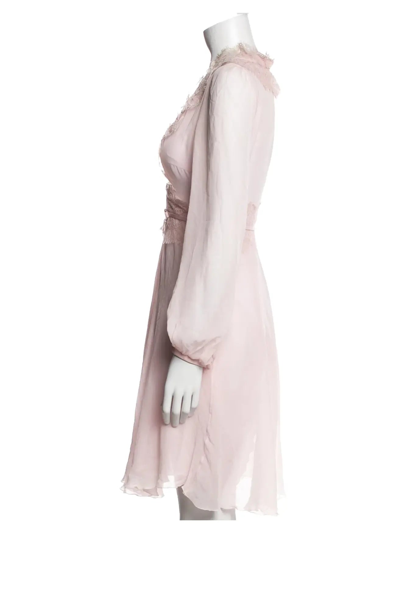 Vista lateral izquierda del vestido Giambattista Valli sobre maniquí, mostrando el discreto cierre de cremallera y la silueta fluida y estructurada.