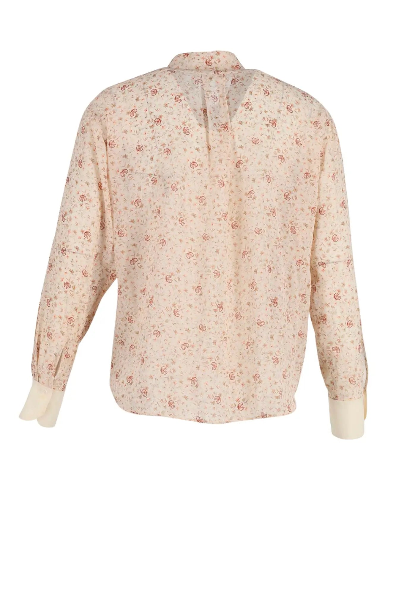 La parte trasera de la blusa Chloé presenta un estampado de microflores, un corte fluido y elegantes detalles para una silueta ligera y femenina.