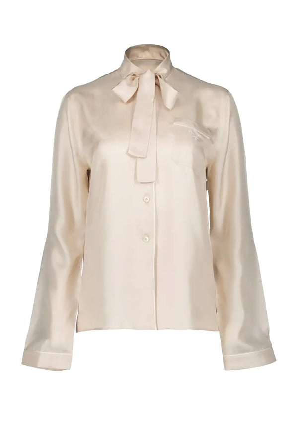 Chemisier Ascot Prada de soie beige avec son noeud ascot. 