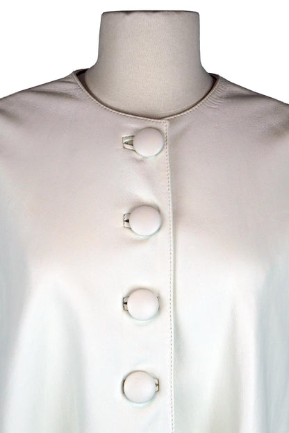 1000073 Close-up of buttons, Lanvin cape in ivory white leather.